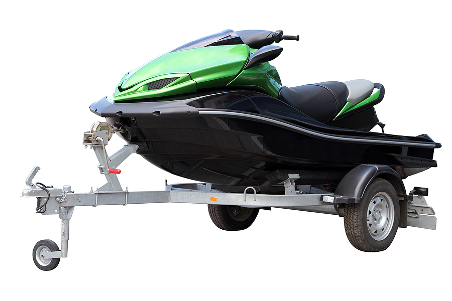 Green hydrocycle on the automobile trailer isolated on a white background